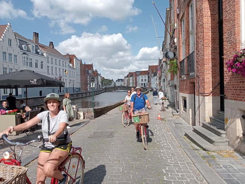 Bruges: Guided Retro Bike Tour of Highlights and Hidden Gems - Market Square wrap, plus windmills and Lake of Love vibes