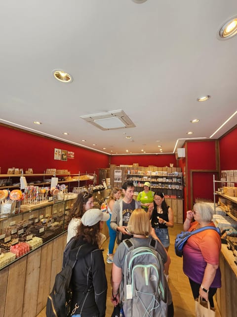 Bruges: Walking Tour with Hot Chocolate & Chocolate Tasting - Church of Our Lady and Walplein: more than scenic stops
