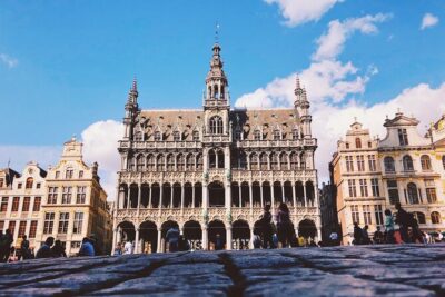 Brussels Highlights Walking and Bus Tour w/ Waffle - Grand Place walk: medieval heart, UNESCO status, and the 1695 rebuild