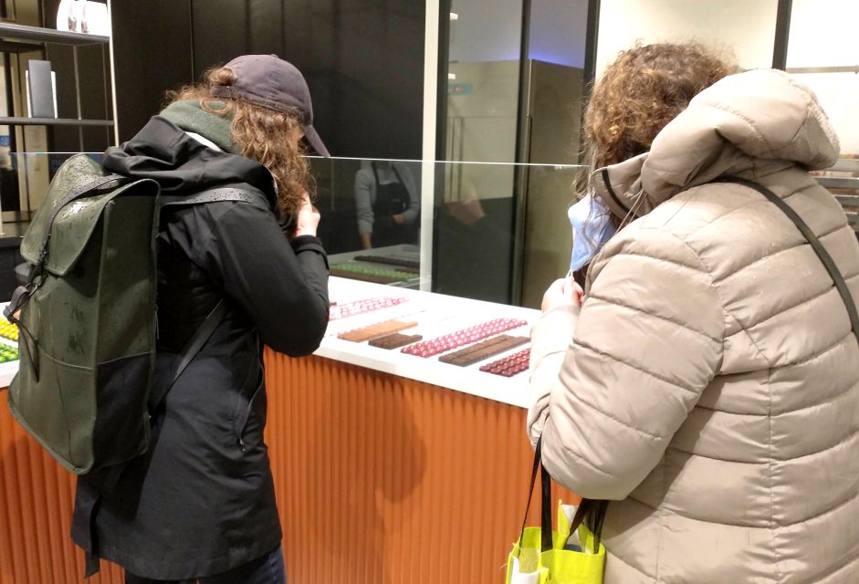 Ghent: Guided City Tour with Chocolate Tastings - Entering the chocolate story right on Vrijdagmarkt