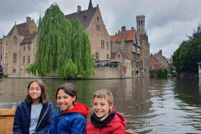 Guided boat trip and walk - From Historium Bruges to the Markt: belfry, guild houses, and town-square drama